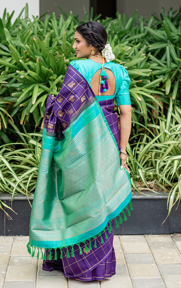 Aubergine colour kanchi pattu saree with checks and buttas