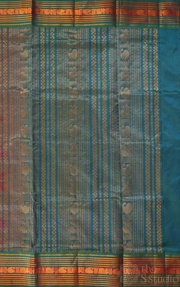 Bright orange silk cotton saree with sea blue korvai border