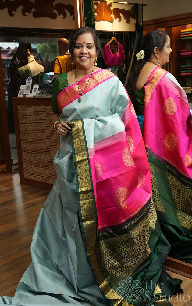 Grey kanjivaram silk saree with ganga jamuna korvai borders