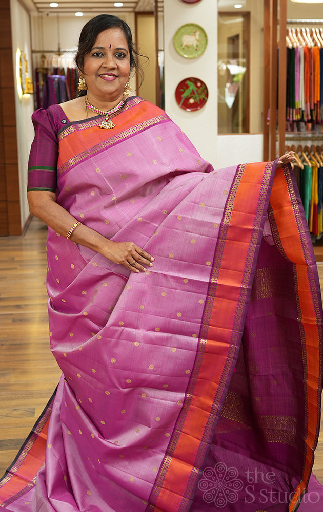 Pinkish lavendar kanchipuram silk saree with purple rettai pet border