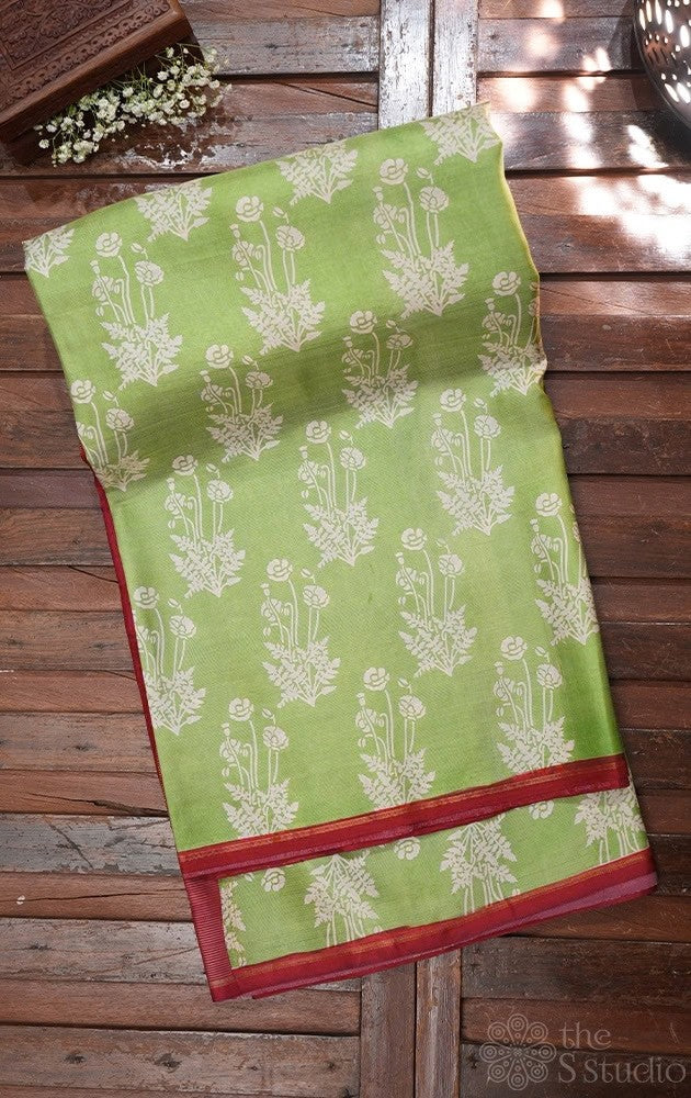 Elachi green kanchipuram silk saree with prints and a maroon pallu