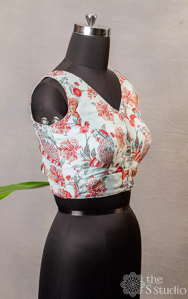 Light blue floral printed sleeveless semi silk readymade blouse