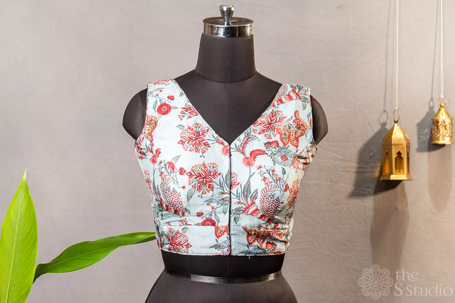 Light blue floral printed sleeveless semi silk readymade blouse