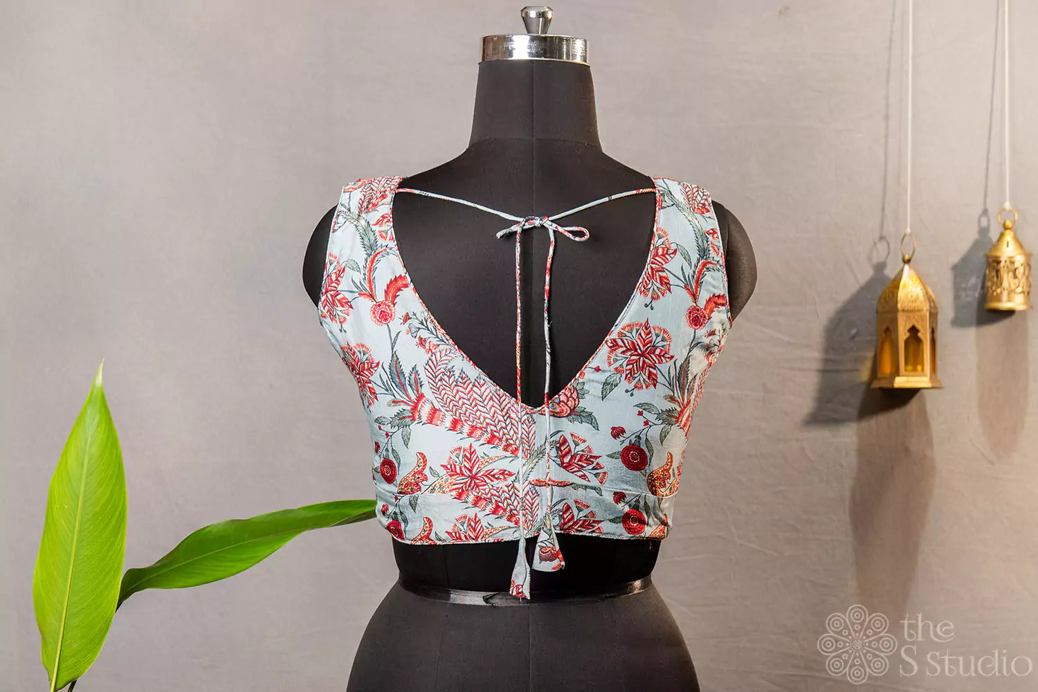 Light blue floral printed sleeveless semi silk readymade blouse