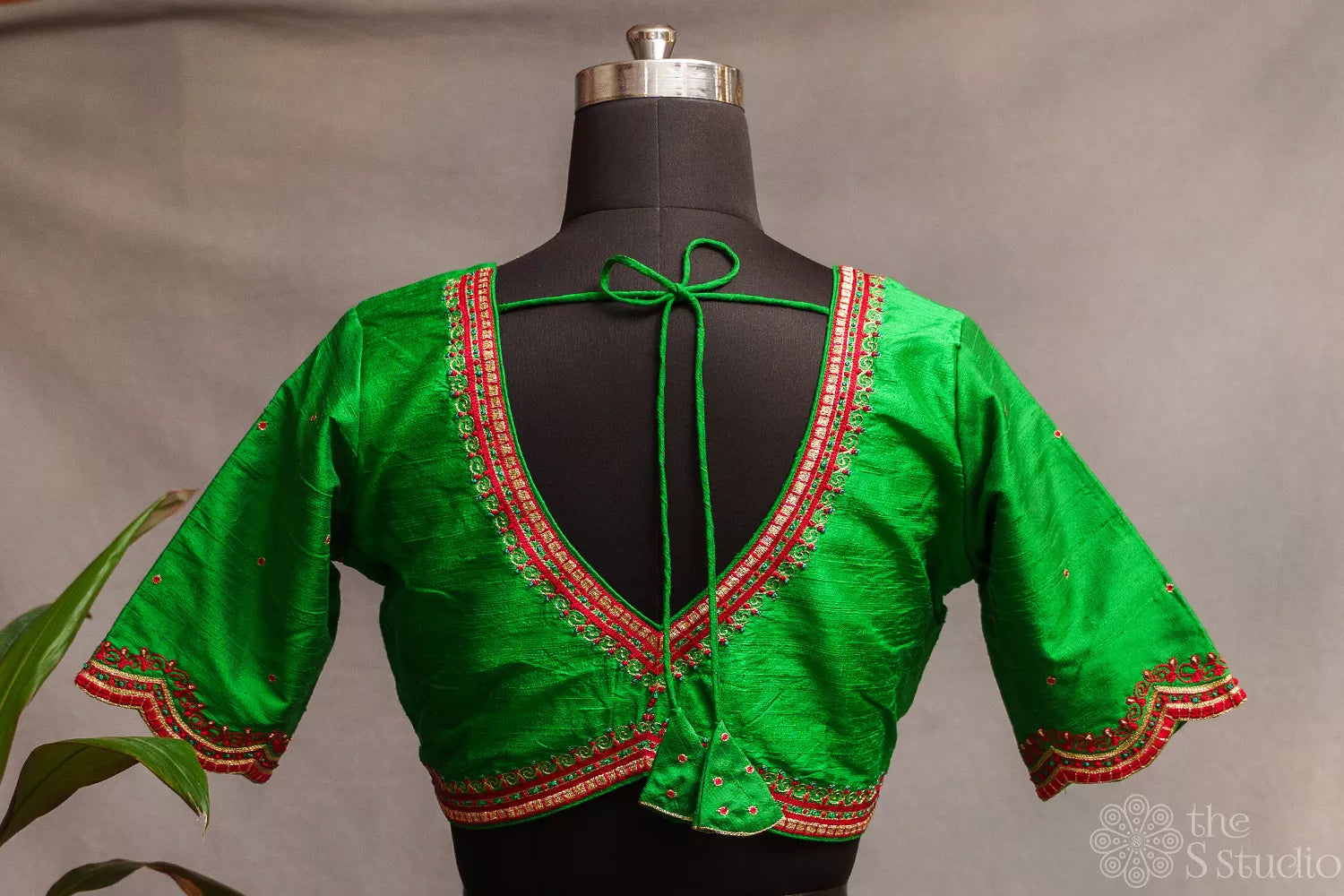 Green raw silk readymade blouse with aari work embroidery