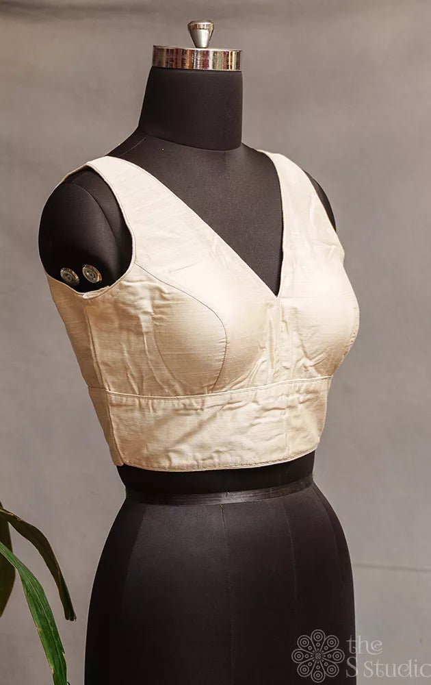 Off white cotton sleeveless readymade blouse
