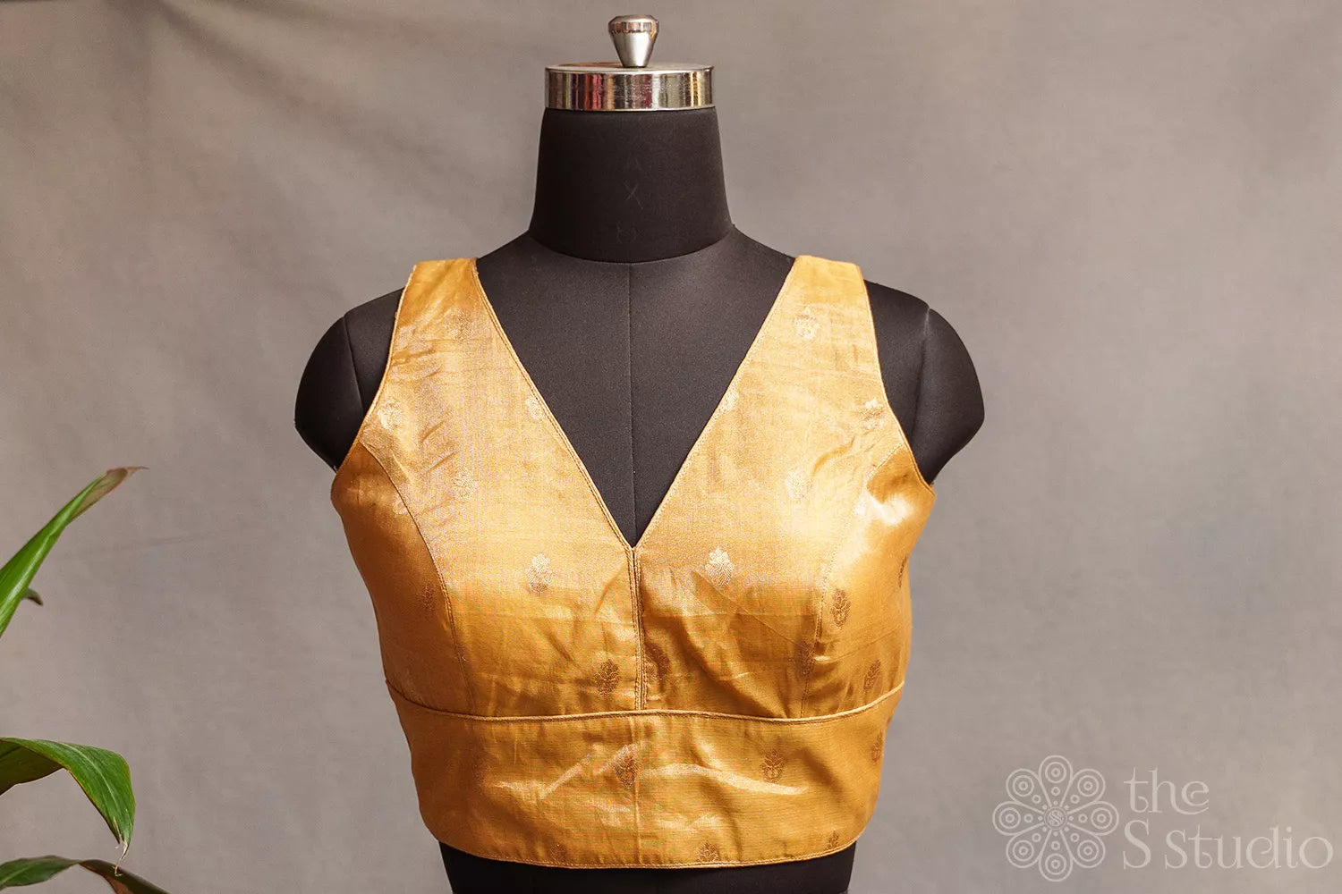 Golden tissue sleeveless readymade blouse with zari buttas