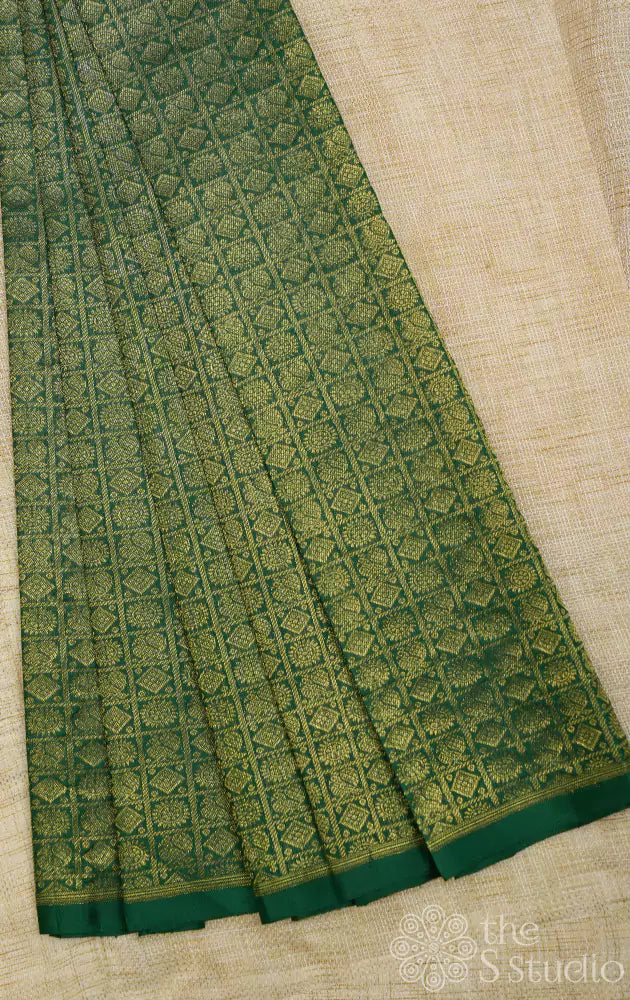 Dark green kanchi silk blouse material with mayil chakram buttas