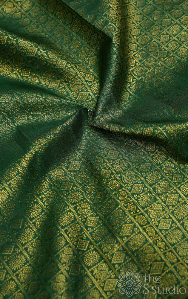 Dark green kanchi silk blouse material with mayil chakram buttas