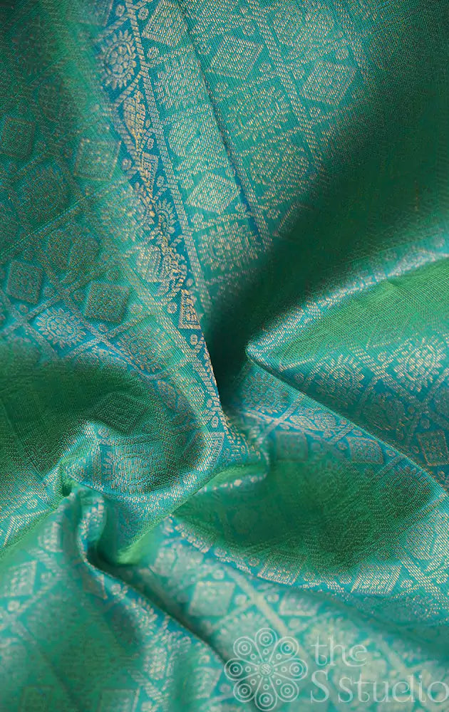 Sea blue kanchi silk blouse material with mayil chakaram motifs