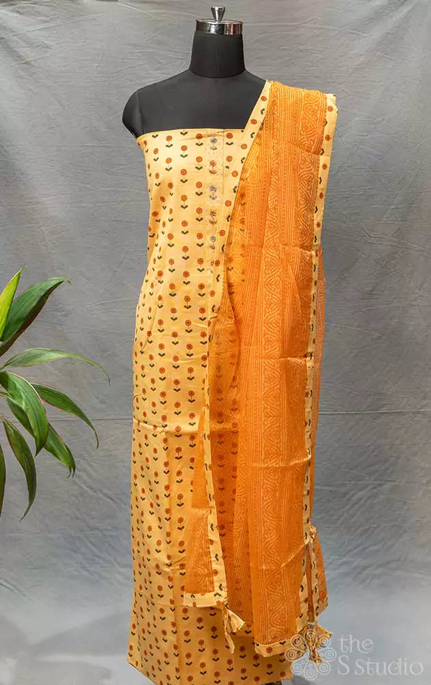 Beige and orange floral printed cotton salwar set with yoke embroidery