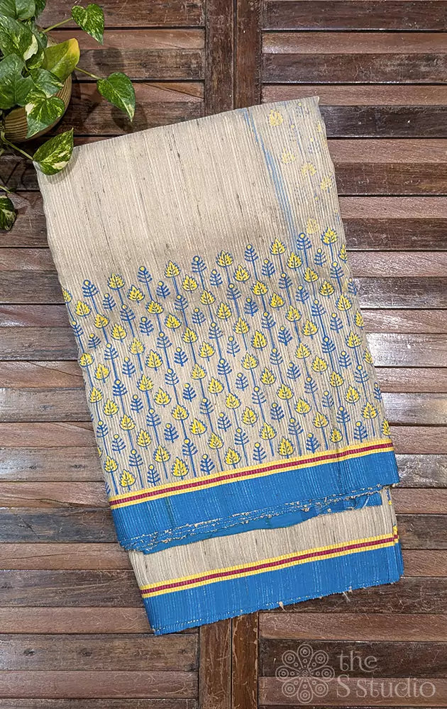 Beige semi tussar saree with blue border