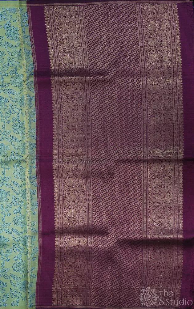 Elachi green and royal blue partly pallu kanchi silk saree with prints