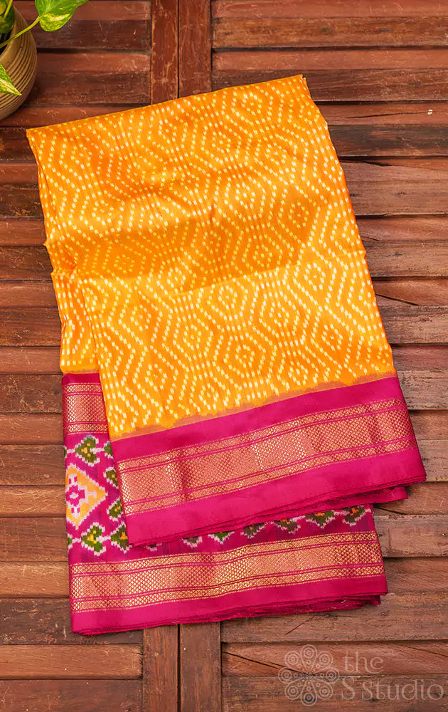 Mango orange ikkat silk saree with rani pink border