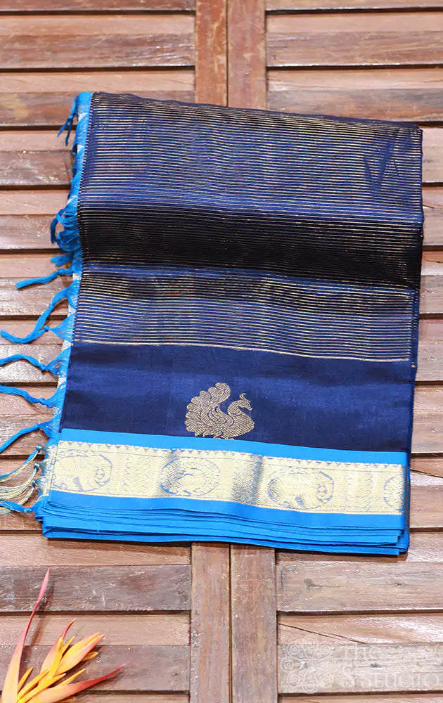 Royal blue silk cotton saree with zari checks and peacock motifs and light blue border
