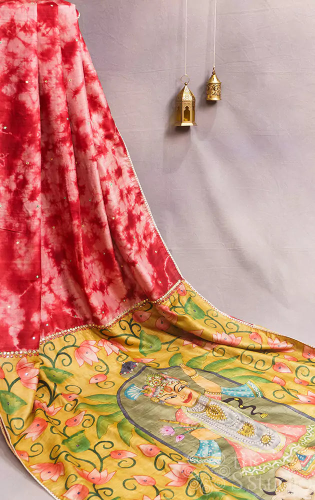 Red shibori tie and dye tussar silk saree with handpainted krishna on the pallu