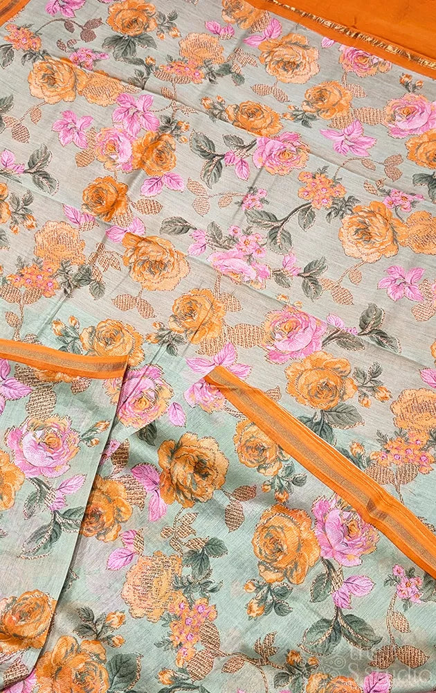 Pale green chanderi cotton saree with mustard floral prints