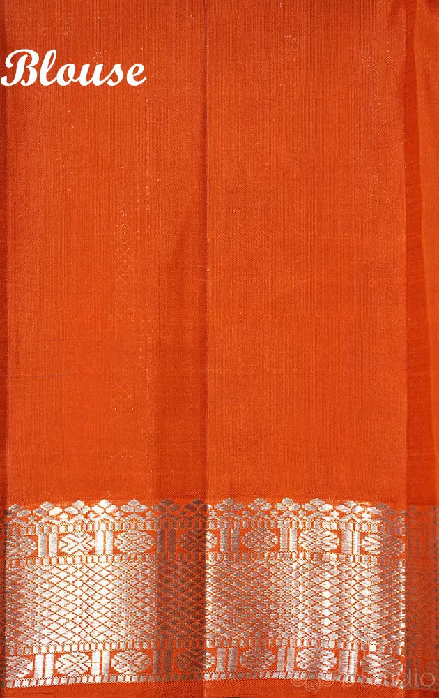 Navy blue kanchipuram silk saree with silver zari buttas