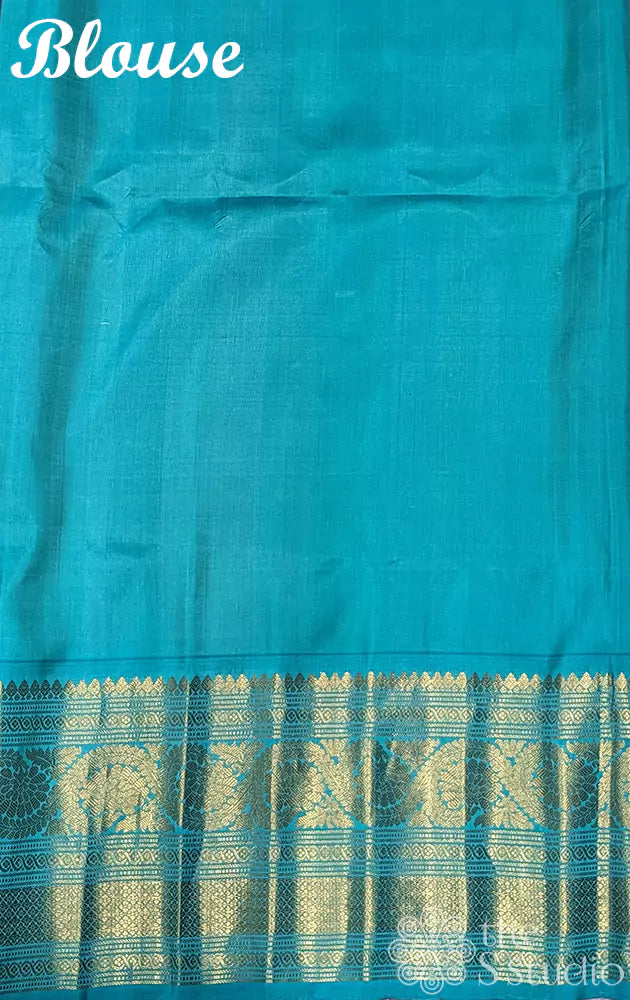 Peachish pink gadwal silk saree with teal blue border