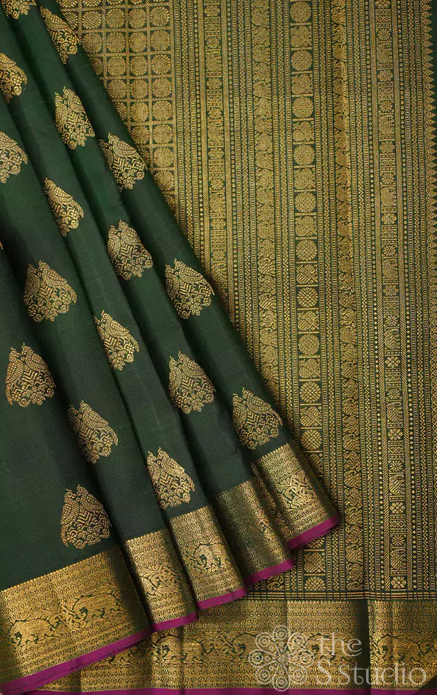 Bottle green kanchipuram silk saree with woven jodi kili zari motifs