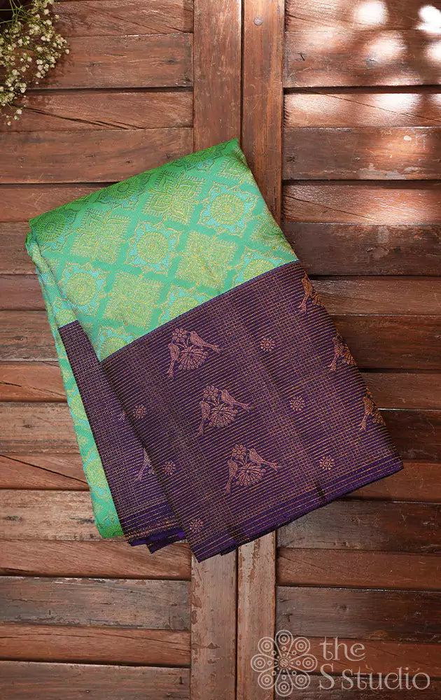Sea green kanchi silk saree with violet border