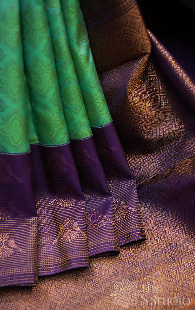 Sea green kanchi silk saree with violet border