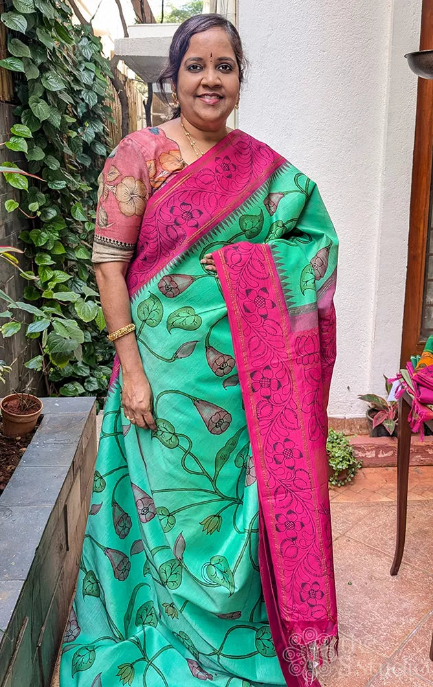 Sea green kanchi silk saree with all over handpainted kalamkari floral motifs