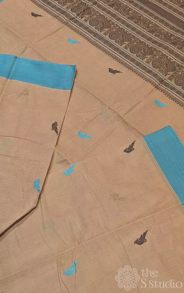 Beige kanchi cotton saree adorned with parrot motifs