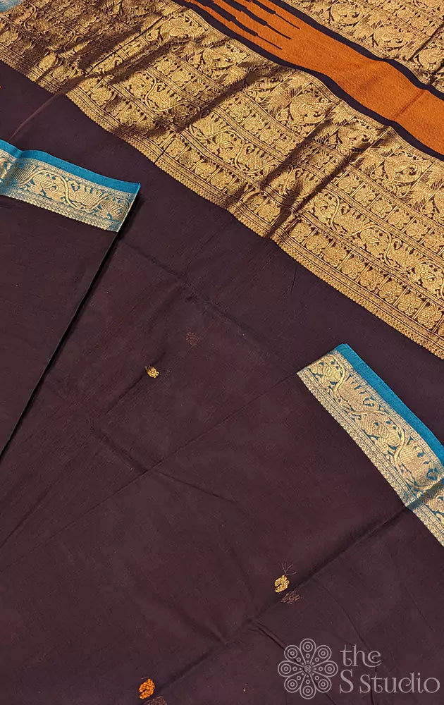 Dark purple Kanchi cotton saree with a sea blue border woven in zari.