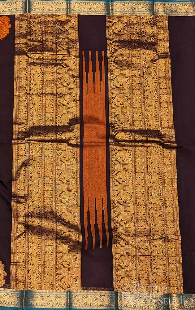 Dark purple Kanchi cotton saree with a sea blue border woven in zari.