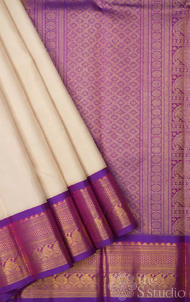 Off white kanchipuram silk saree with purple border