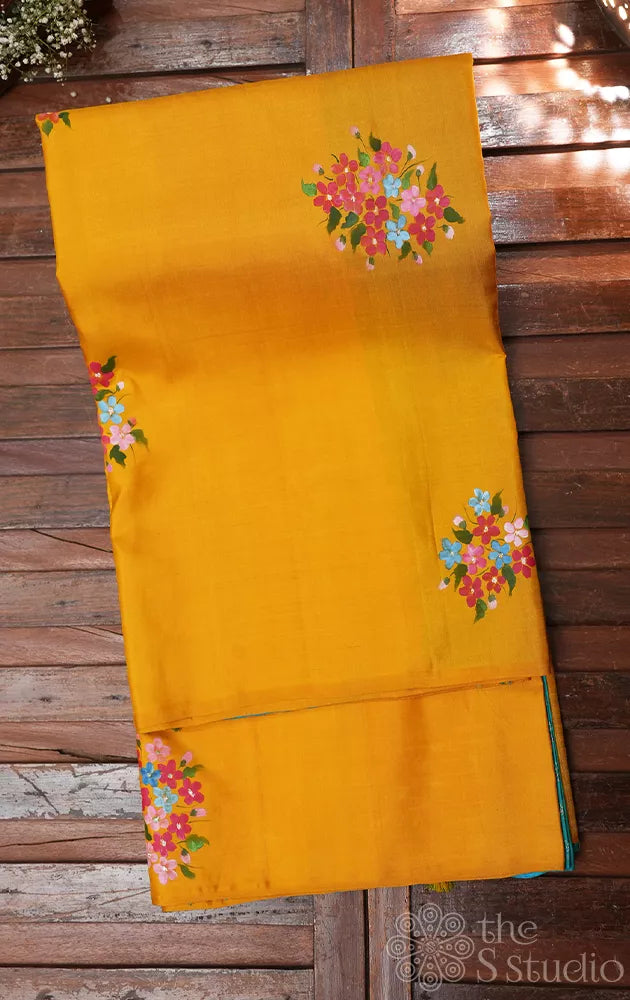 Mustard and aqua blue hand painted kanchipuram silk saree with party pallu