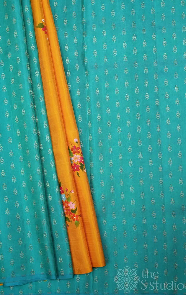 Mustard and aqua blue hand painted kanchipuram silk saree with party pallu