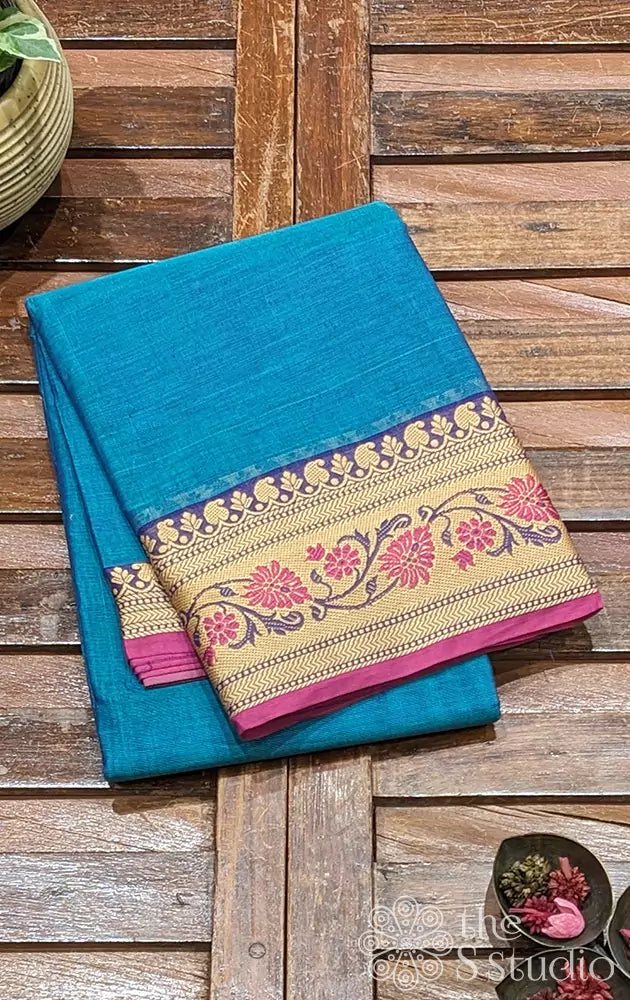 
Turquoise blue Kanchi cotton saree with thread border