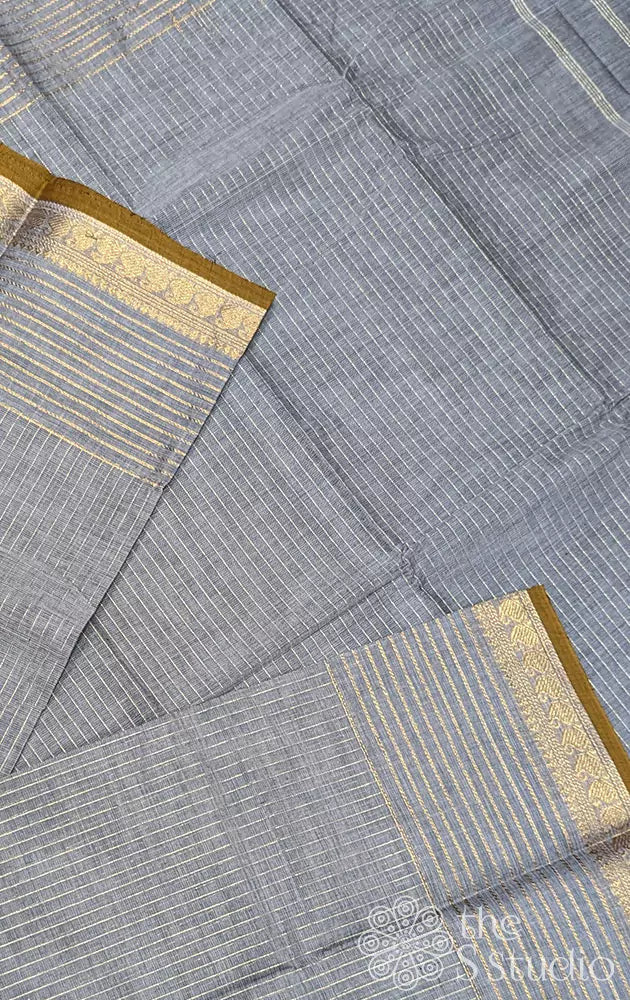 Grey Kanchi cotton saree adorned with zari lines throughout the body