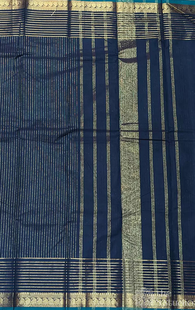 Peacock blue kanchi cotton saree with zari lines along the border