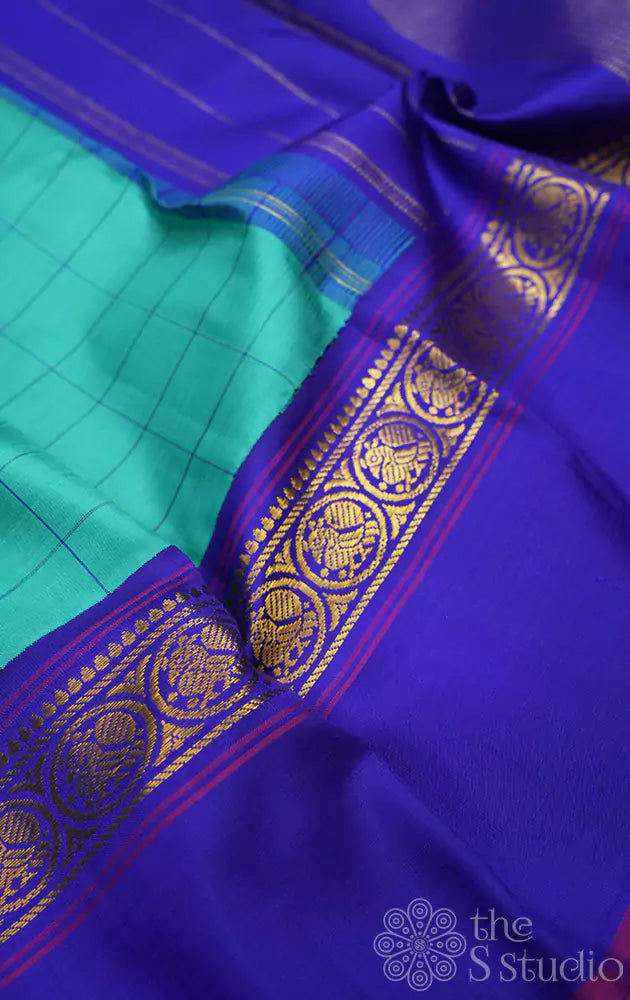 Sea green kanjivaram silk saree with royal blue border