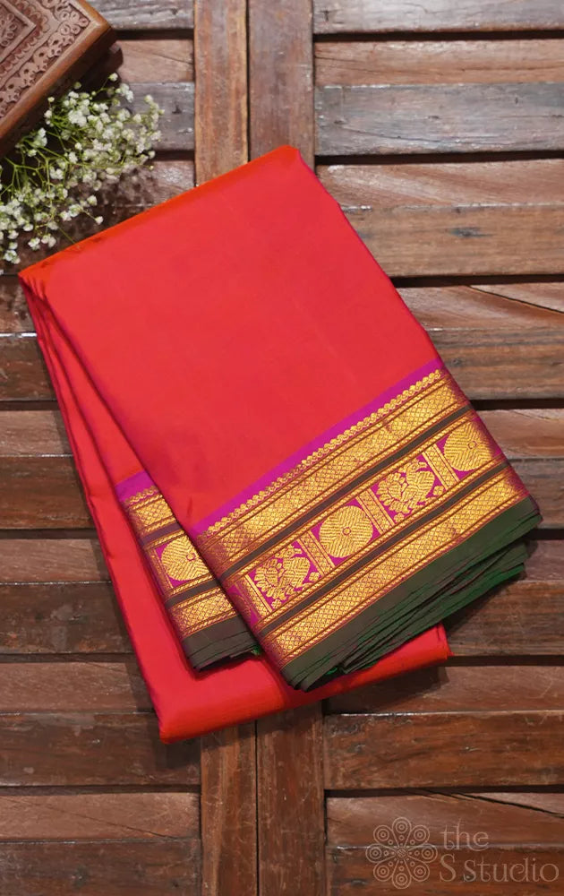Peach plain kanchipuram silk saree with magenta and green border