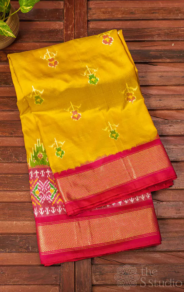 Mustard ikkat silk saree with rani pink zari border