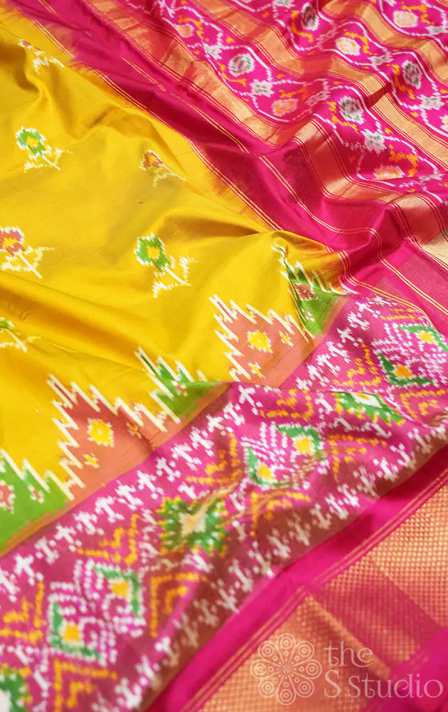 Mustard ikkat silk saree with rani pink zari border
