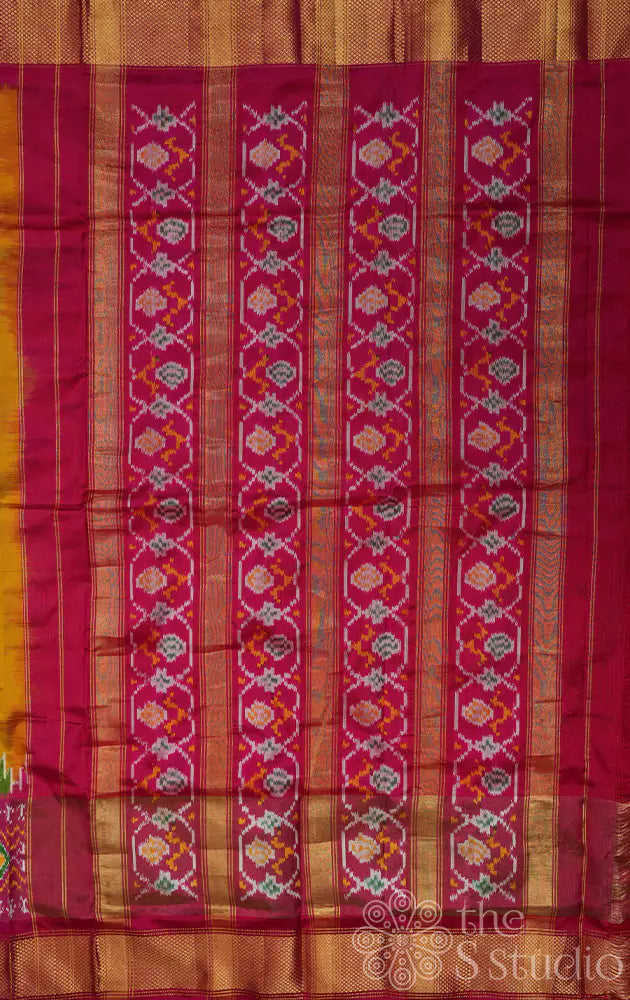 Mustard ikkat silk saree with rani pink zari border