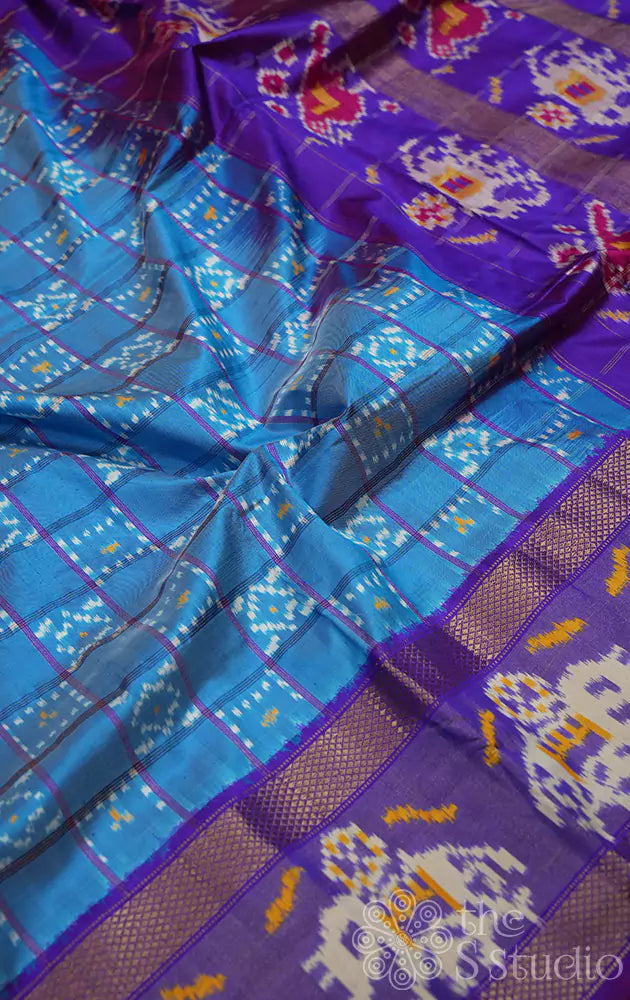 Light blue checked ikkat saree with elephant motif border