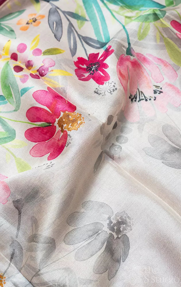 Light grey tussar silk saree with floral prints and dark pink selvedge