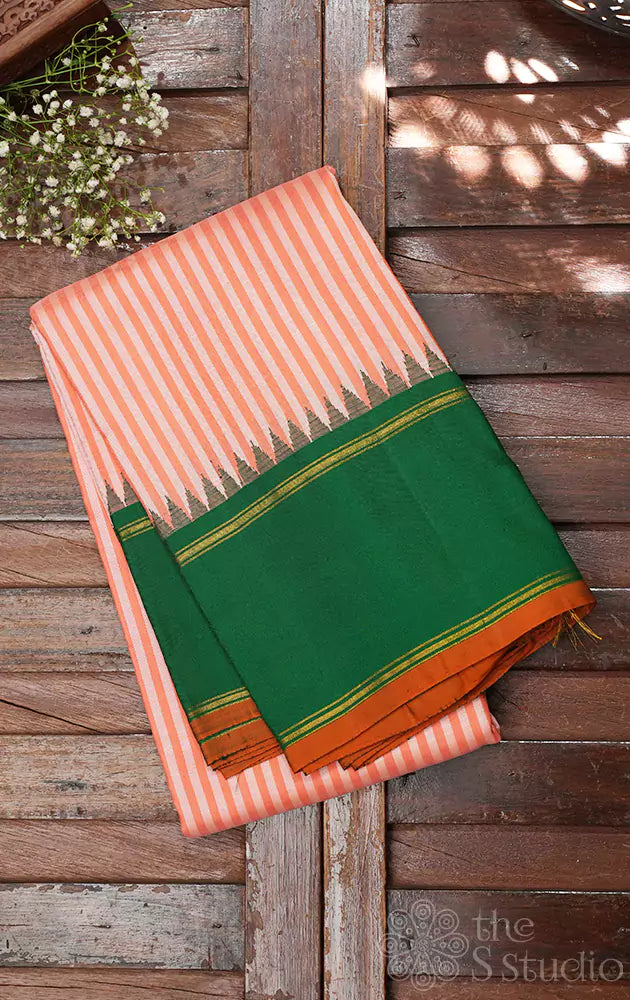 Peach kanchipuram silk saree with green korvai border