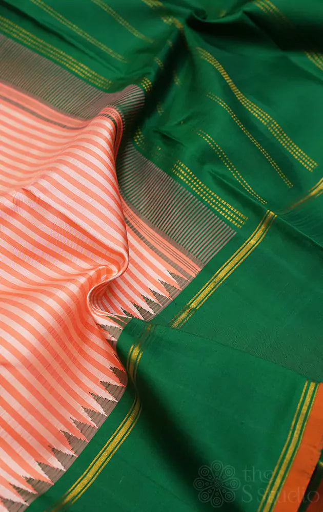 Peach kanchipuram silk saree with green korvai border