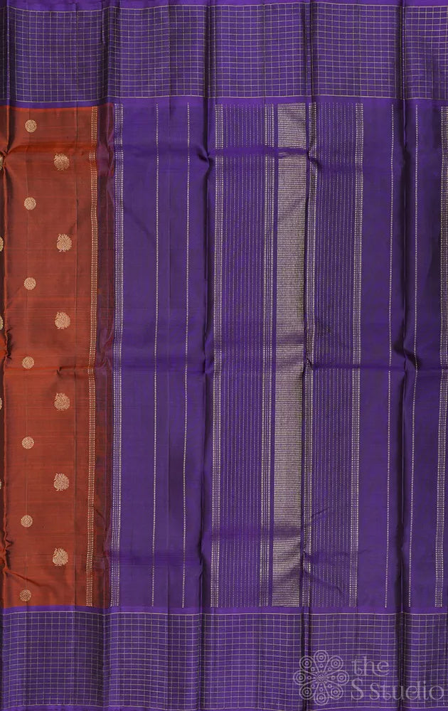 Rust kanchi pattu saree with violet checked border