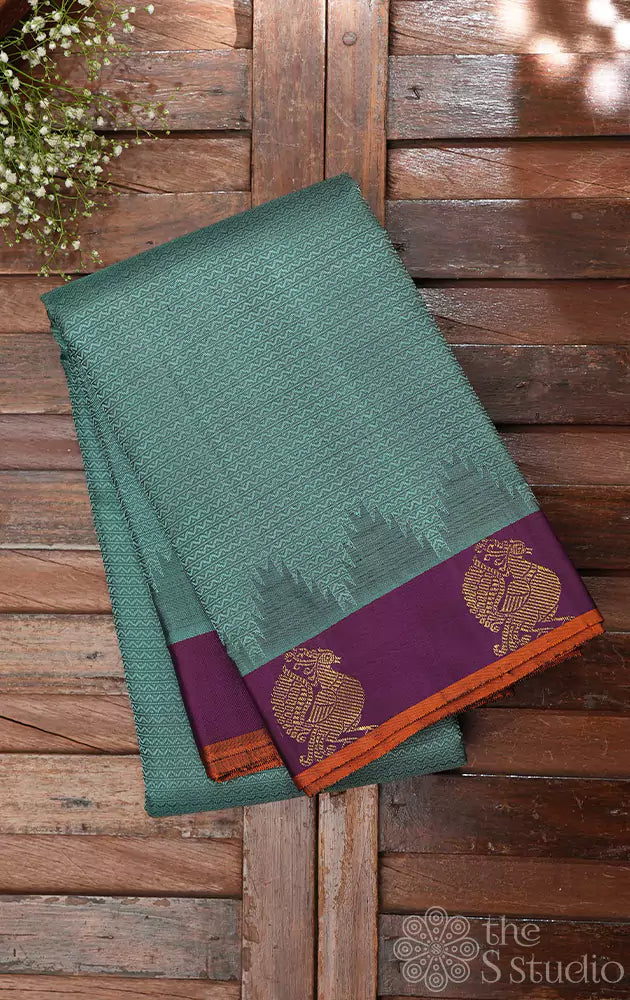 Bluish grey kanchipuram silk saree with small purple border