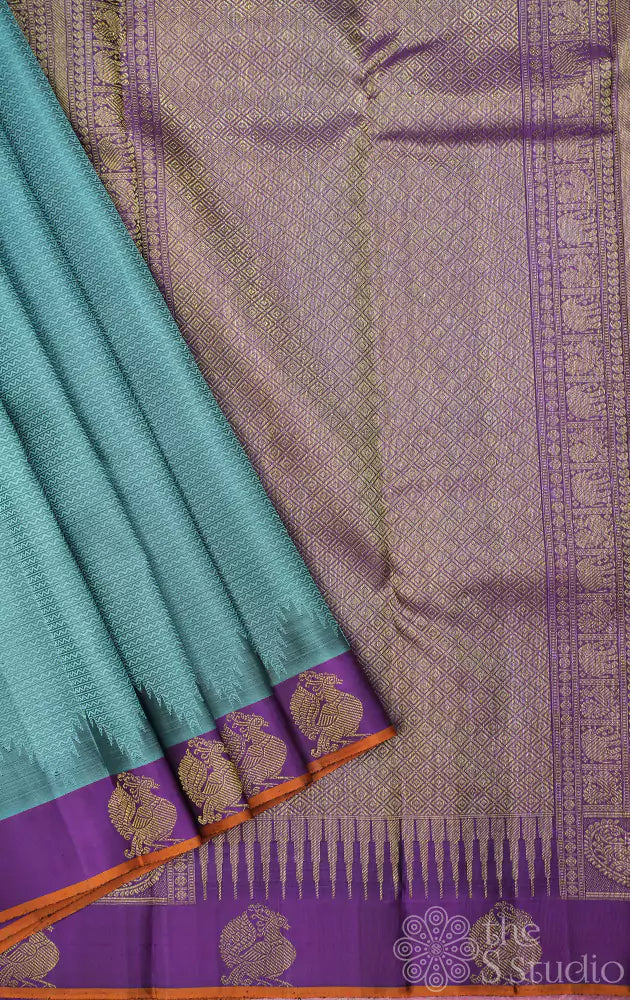 Bluish grey kanchipuram silk saree with small purple border