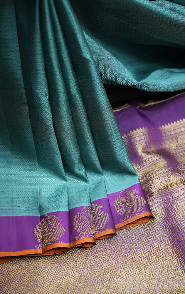 Bluish grey kanchipuram silk saree with small purple border
