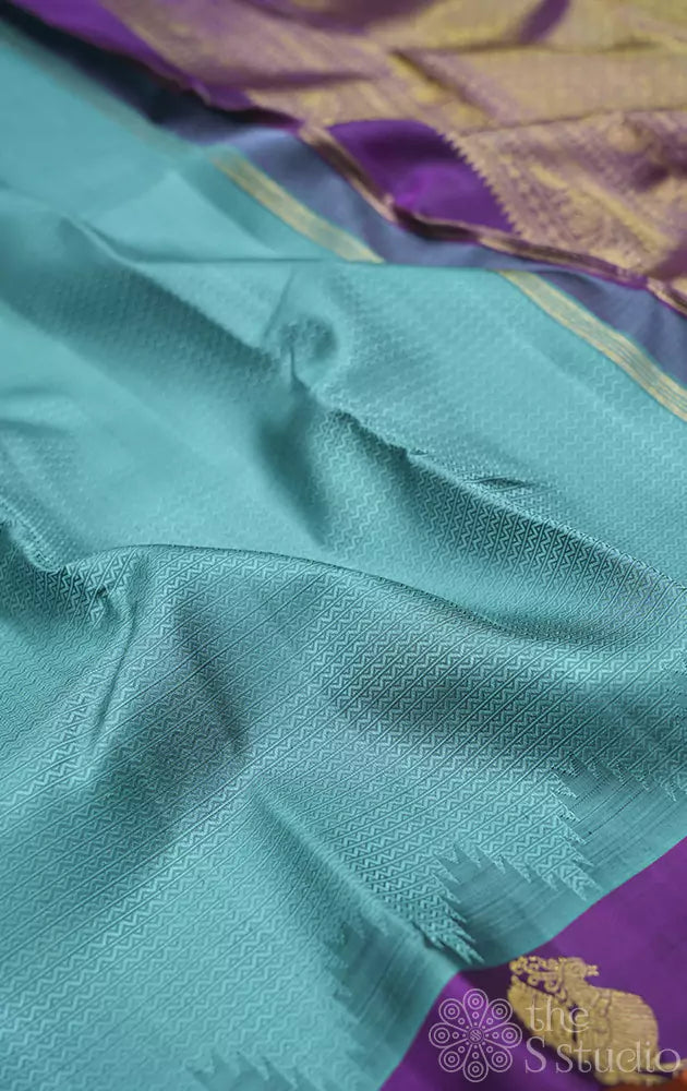 Bluish grey kanchipuram silk saree with small purple border